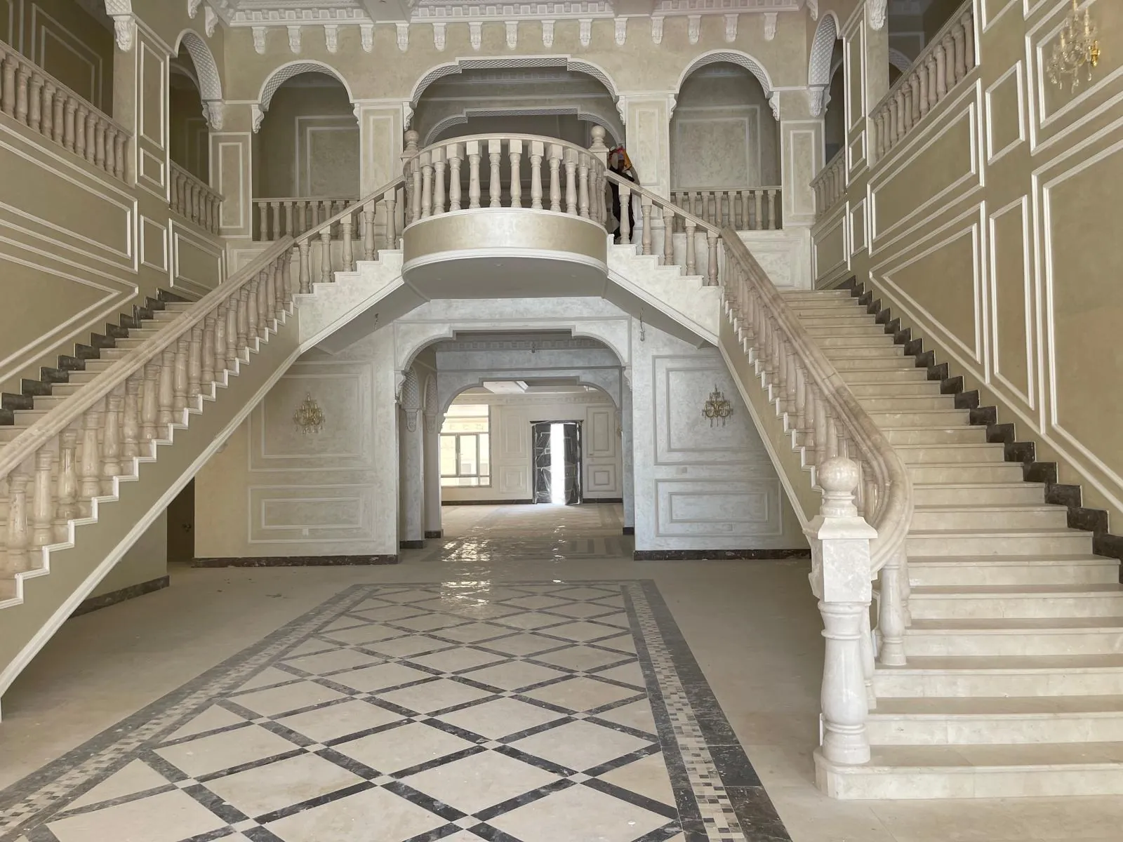 Double marble staircase in a villa entrance hall