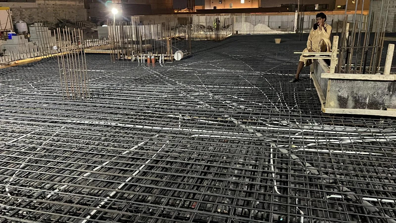Steel reinforcement laid out for a foundation slab