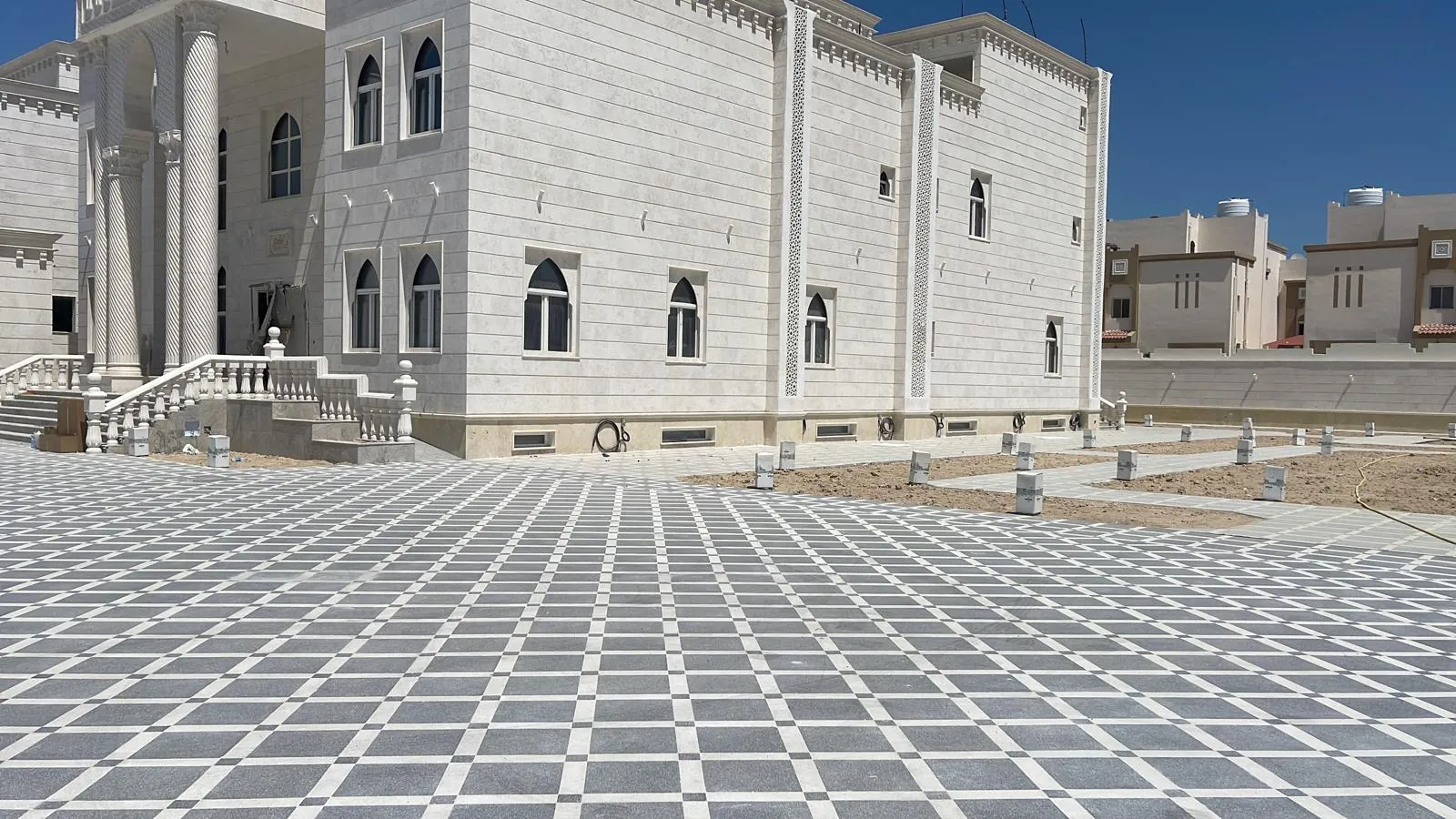 Stone villa and patterned paving